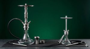 Heavy commercial grade versus lightweight travel hookah showing design and size differences