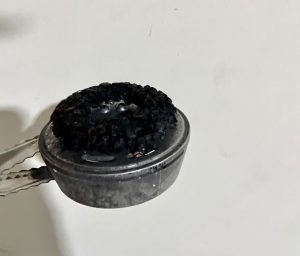 Top view of HMD placed directly on tobacco showing contact packing method